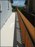 Replaced siding and railing: after