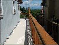 Replaced siding and railing: after